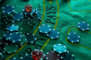 Poker chips on bokeh background. Casino theme. photo