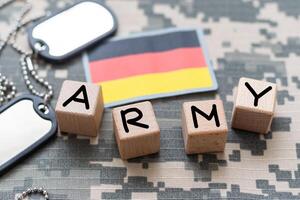 Germany army uniform patch flag on soldiers arm. Military Concept. photo