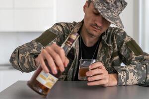 one man sit at home with bottle of liquor drink whiskey drunk alcoholic Alcohol abuse, addiction and man depression concept drink and drive copy space hold car keys photo