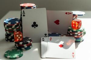 two aces in the hands of a close up. An concept Image of a poker table. two aces, two playing cards and poker chips on the green casino table on a black background. success in gambling. soft focus photo