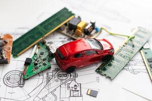 Electronic circuit board close up with car toy photo