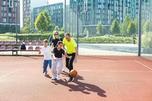 Caucasian family playing basketball together. Happy family spending free time together. photo