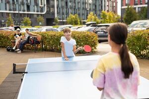 girl plays in table tennis outdoor photo