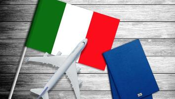 Toy airplane placed on the national flag of Italy. photo