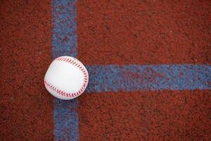 one baseball on infield of sport field photo