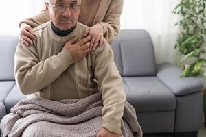 Two people holding hand together. elderly man and support woman photo