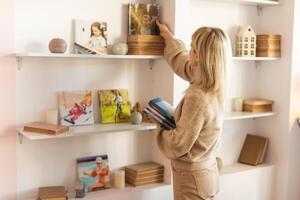 Happy Young Woman With Photo Album