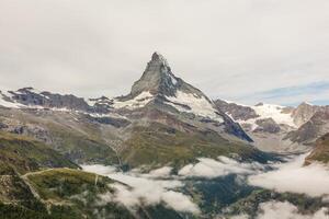 Amazing view of touristic trail near the Matterhorn in the Swiss Alps. photo