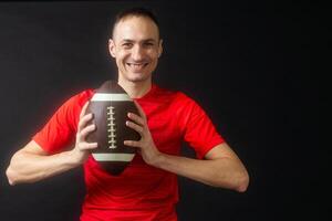 A rugby player, isolated on black photo