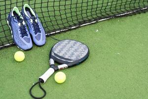 Paddle tennis objects and court. photo