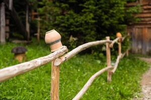 Old wooden farmhouse fence with jugs photo