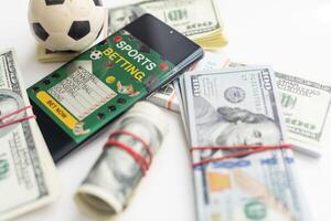 soccer ball over a lot of money. corruption football game. Betting and gambling concept. wold cup photo