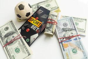 soccer ball over a lot of money. corruption football game. Betting and gambling concept. wold cup photo