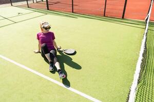 One women playing Paddle tennis photo