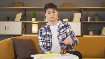 The young man drinking tea is happy. video