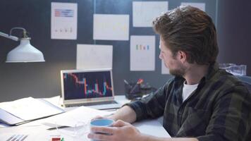 Thoughtful stockbroker in his office. video