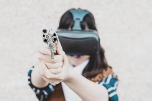 Portrait of a beautiful Chinese female cowgirl using the virtual reality viewer photo