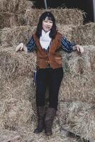 Portrait of a beautiful armed Chinese female cowgirl photo