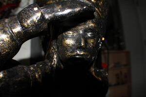 A Bronze Indian Statue Close Up photo