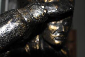 A Bronze Indian Statue Close Up photo