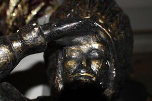 A Bronze Indian Statue Close Up photo