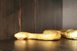 Shiny Golden Snake Decoration Up Close photo