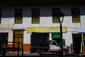 View of the houses around the central square of the beautiful small town of Pacora in Colombia photo