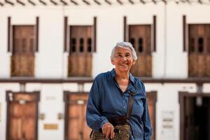 Senior woman tourist at the beautiful heritage town of Salamina in the department of Caldas in Colombia photo