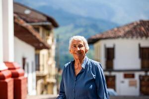 Senior woman tourist at the beautiful heritage town of Salamina in the department of Caldas in Colombia photo