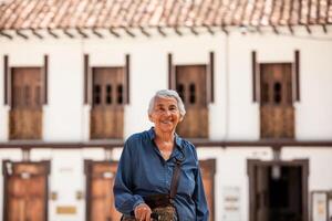 Senior woman tourist at the beautiful heritage town of Salamina in the department of Caldas in Colombia photo