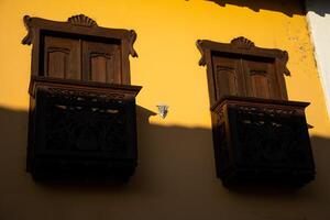 Detail of a beautiful facade of the houses at the historical downtown of the heritage town of Salamina located at the Caldas department in Colombia. photo