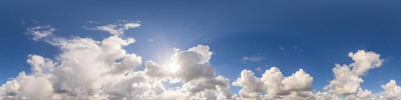 Blue sky panorama with puffy Cumulus clouds. Seamless hdr pano in spherical equirectangular format. Sky dome or zenith for 3D visualization, game and sky replacement for aerial drone 360 panoramas. photo