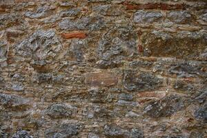 Texture of a stone wall. Old stone wall texture background. Stone wall as a background or texture photo