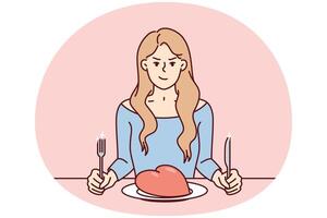 Frowning woman sits at table with giant heart in plate and holds fork with knife. image vector