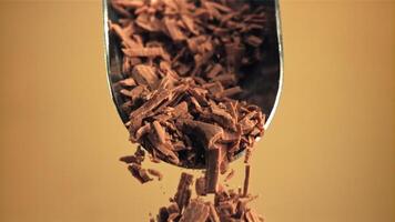 Super slow motion falling of grated milk chocolate from a scoop. Filmed on a high-speed camera at 1000 fps. video