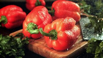 Drops of water fall on the sweet pepper with greens. Filmed is slow motion 1000 fps.High quality FullHD footage video