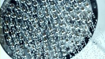 A closeup shot of a shower head releasing a stream of water, showcasing the refreshing and soothing experience of a shower. Ideal for relaxation and selfcare content video