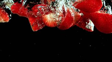 Super slow motion strawberries underwater. High quality FullHD footage video