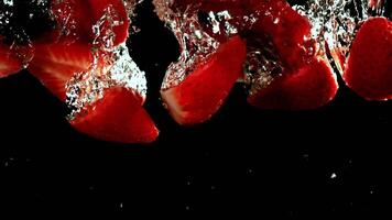 Super slow motion strawberries underwater. High quality FullHD footage video
