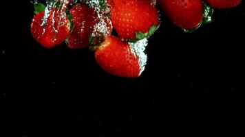 Super slow motion strawberries underwater. High quality FullHD footage video