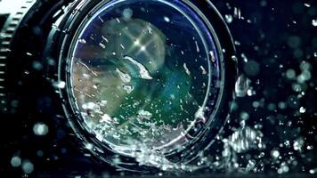 Super slow motion drops of water fall on camera, lens. High quality FullHD footage video