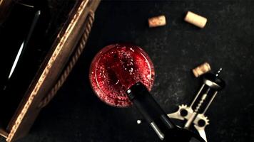 Super slow motion from the bottle pour the wine into the glass. Top view. On a black background. Filmed on a high-speed camera at 1000 fps.High quality FullHD footage video