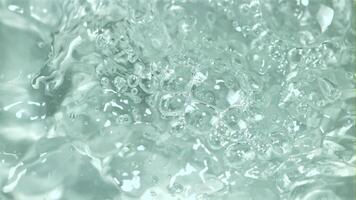 Water with air bubbles. Macro background. Filmed is slow motion 1000 frames per second. High quality FullHD footage video