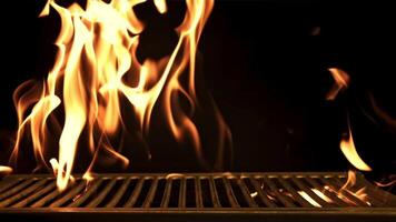 Grill with flames. On a black background. Filmed is slow motion 1000 frames per second. High quality FullHD footage video