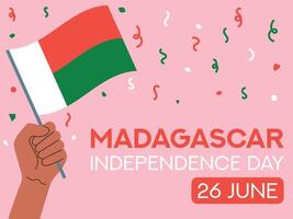 Madagascar independence day 26 June. Madagascar flag in hand. Greeting card, poster, banner template vector