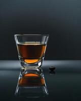 Coffee in Glass Cup on Wet Surface photo