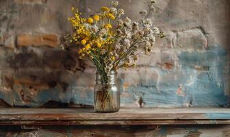 A rustic mantel adorned with a mason jar filled with Mimosa branches photo