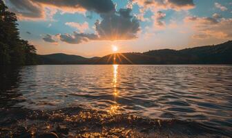 A summer sunset casting warm hues over the peaceful lake photo