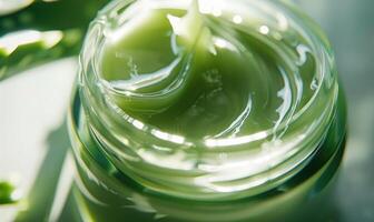 Close-up of a blank jar mockup filled with aloe vera face cream, skin care routine photo