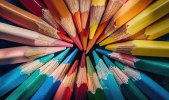 An overhead shot of colored pencils arranged in a pattern, abstract background with colored pencils photo